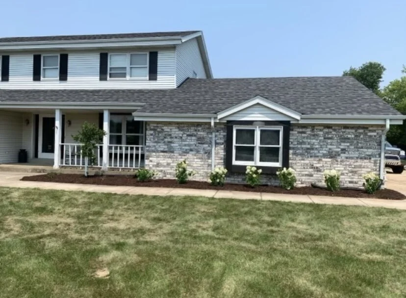 After: refreshed front bed with new mulch